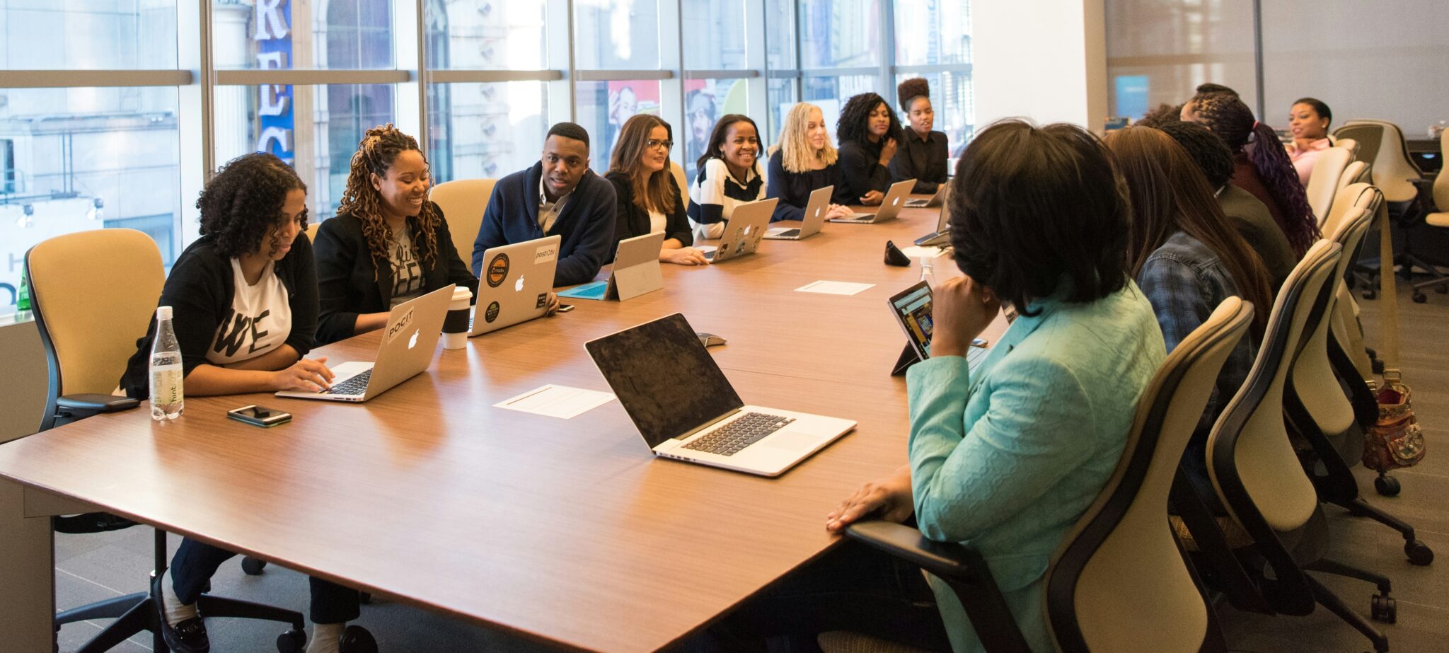 people at conference table people at conference table participating in title IX training